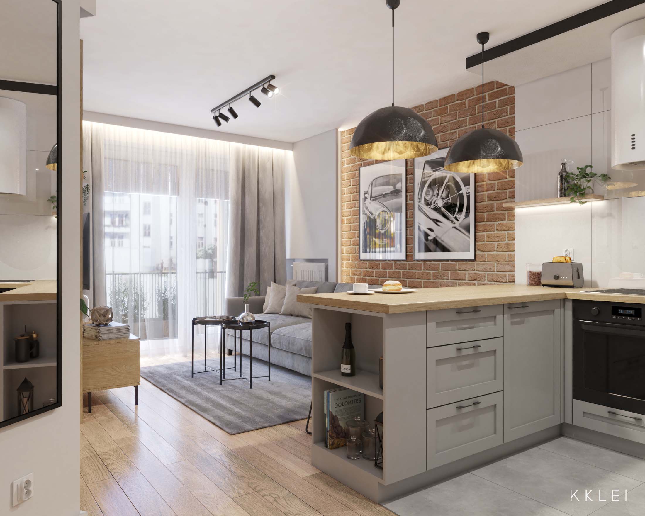 Małe mieszkanie o nieregularnym układzie z aneksem kuchennym i ceglaną ścianą w loftowym stylu